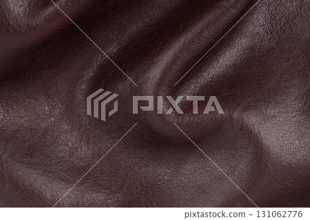 Wrinkled brown leather surface close up Wrinkled brown leather surface close up 131062776