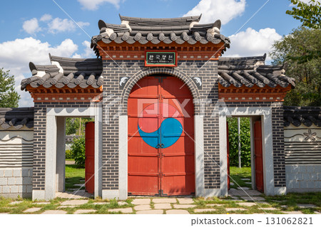 Traditional Korean main gate or main entrance. Korean style gate entrance with yin and yang symbol. Park Garden of Friendship Kazakhstan Korea or Korean Garden. Astana, Nur-Sultan, Kazakhstan 8.20.25 Traditional Korean main gate or main entrance. Korean style gate entrance with yin and yang symbol. Park Garden of Friendship Kazakhstan Korea or Korean Garden. Astana, Nur-Sultan, Kazakhstan 8.20.25 131062821