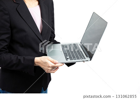 Businesswoman in black suit holding laptop computer, concept of digital technology, online communication, remote work, corporate presentation, modern office lifestyle, professional management, and 131062855
