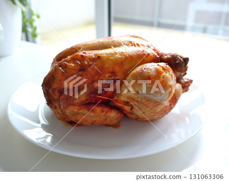 Juicy Roasted Turkey On White Plate With Golden Skin: A Perfect Dinner Centerpiece 131063306