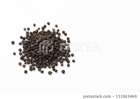 Black pepper on a white background 131063469