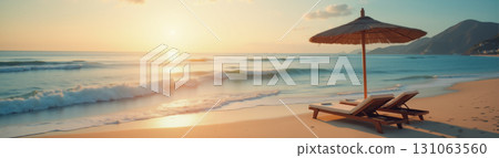 Wide panorama of seascape where in foreground sun lounger and umbrella on the beach, beautiful waves, beautiful sea background, summer vacation and travel concept 131063560