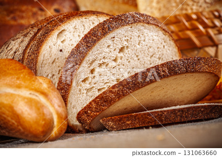 Fresh baked bread. Assorted bakery products loafs of bread and rolls... 131063660
