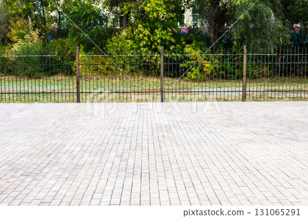 Spacious Park Square Paved with Construction Stones: A Beautifully Designed Outdoor Area for Leisure and Community Activities in Urban Environment 131065291