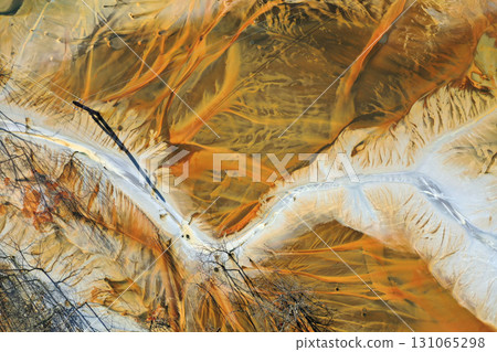 Aerial view of a big waste decanting lake, tailing pond. Mining residual waters discharged from copper mine Aerial view of a big waste decanting lake, tailing pond. Mining residual waters discharged from copper mine 131065298