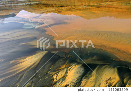 Aerial view of a big waste decanting lake, tailing pond. Mining residual waters discharged from copper mine Aerial view of a big waste decanting lake, tailing pond. Mining residual waters discharged from copper mine 131065299
