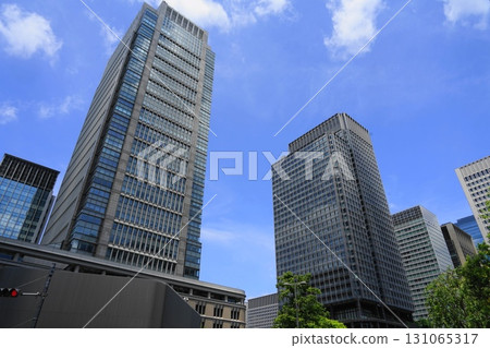 Skyscrapers towering against the blue sky Skyscrapers towering behind Tokyo Station August Central 863 Maru Building and Shin-Maru Building in front of Tokyo Station Skyscrapers towering against the blue sky Skyscrapers towering behind Tokyo Station August Central 863 Maru Building and Shin-Maru Building in front of Tokyo Station 131065317
