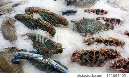 Crab and seafood on ice look appetizing and fresh, inviting culinary creativity and taste of ocean bounty 131065405
