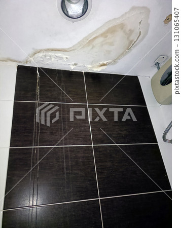 Bathroom damage reveals concerning leak, leaving homeowner frustrated with unsightly peeling paint Bathroom damage reveals concerning leak, leaving homeowner frustrated with unsightly peeling paint 131065407