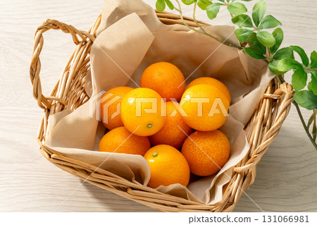 Fresh kumquats and wood grain background Fresh kumquats and wood grain background 131066981
