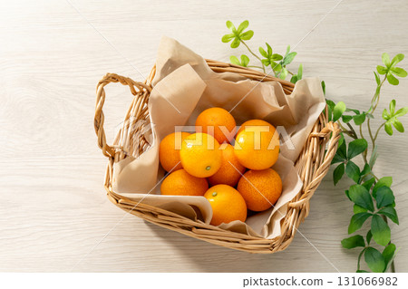 Fresh kumquats and wood grain background 131066982