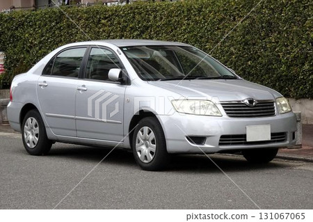 A car parked in a parking lot (Toyota Corolla 10th generation) A car parked in a parking lot (Toyota Corolla 10th generation) 131067065