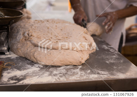 process of making bread. dough kneading 131067926