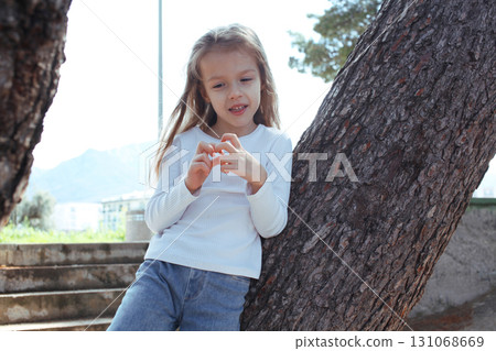young pretty girl dreaming on tree, lifestyle people concept 131068669