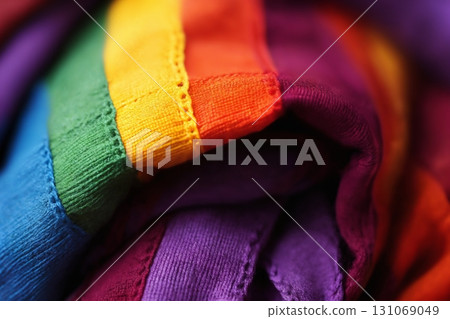Multicolored pieces of knitted fabric as a background, top view 131069049