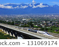 Southern Alps and the new Linear Chuo Shinkansen train 131069174