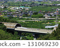 The Linear Shinkansen emerging from the tunnel and the view of the Kofu Basin 131069230