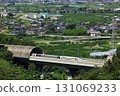 The Linear Shinkansen emerging from the tunnel and the view of the Kofu Basin 131069233