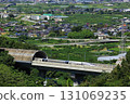 The Linear Shinkansen emerging from the tunnel and the view of the Kofu Basin 131069235