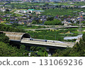 The Linear Shinkansen emerging from the tunnel and the view of the Kofu Basin 131069236