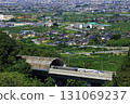 The Linear Shinkansen emerging from the tunnel and the view of the Kofu Basin 131069237