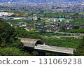 The Linear Shinkansen emerging from the tunnel and the view of the Kofu Basin 131069238