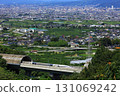 The Linear Shinkansen emerging from the tunnel and the view of the Kofu Basin 131069242