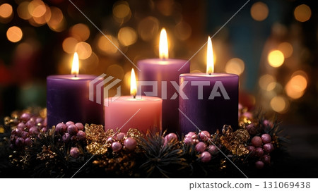 Christmas candles glowing with festive wreath and golden holiday bokeh lights 131069438