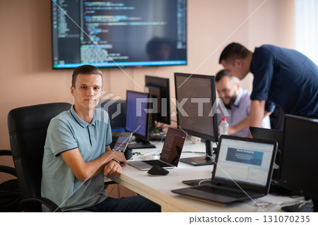 Innovating the Future: A Young Programmer Testing New Smartphone Apps in the Office. Innovating the Future: A Young Programmer Testing New Smartphone Apps in the Office. 131070235