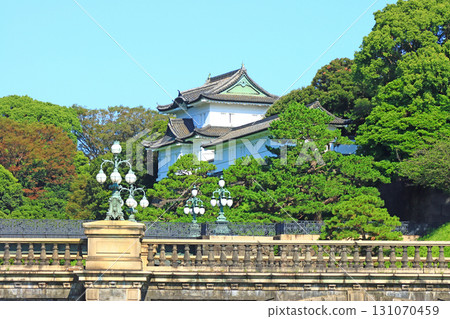 View of the main gate stone bridge and Fushimi Turret in the Imperial Palace Outer Gardens, Chiyoda Ward, Tokyo 131070459