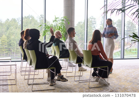 A businesswoman leader guiding a meeting with her colleagues, discussing business challenges, marketing strategies, and new plans for growth and success 131070478