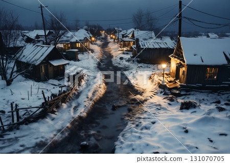 village street in winter season, old weathered homes and dirt on the road, rundown environment, snow, sunset, street lights 131070705