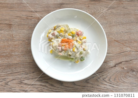 mashed tuna with corn and garden pea couple cabbage vegetable topping shrimp egg salad dressing cream sauce on plate 131070811