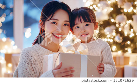 Christmas present: Cute little girl and mom Christmas present: Cute little girl and mom 131071629
