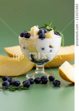 Diet fruit yogurt with melon blueberries and aromatic greens 131072883