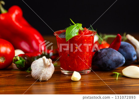 Freshly prepared tomato sauce with red peppers and herbs Freshly prepared tomato sauce with red peppers and herbs 131072893