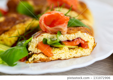 Homemade omelet with red fish and fresh spinach Homemade omelet with red fish and fresh spinach 131072906