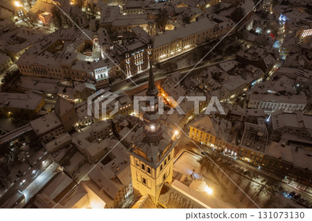 Aerial night View of Tallinn in winter, roofs are covered with snow, Christmas mood 131073130