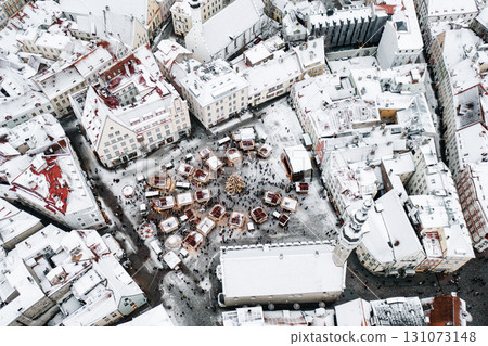Aerial View of Tallinn with the Town Hall Square in winter, roofs with snow, Christmas mood Aerial View of Tallinn with the Town Hall Square in winter, roofs with snow, Christmas mood 131073148