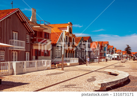 Costa Nova, Aveiro, Portugal: colorful striped houses called Palheiros at street Costa Nova, Aveiro, Portugal: colorful striped houses called Palheiros at street 131073171