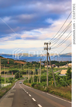 A view of the road to the sea and the windmills A view of the road to the sea and the windmills 131073931