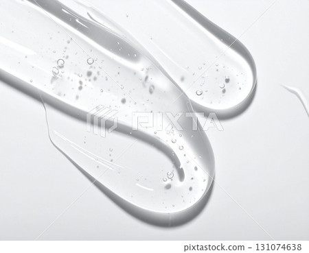 Skin care texture of transparent gel with bubbles spreading on white background 131074638