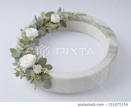 White flower wreath on a marble ring White flower wreath on a marble ring 131075154
