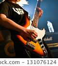 Female bassist performing live 131076124