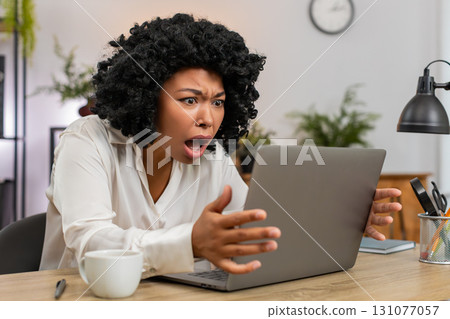African American businesswoman disappointed sees laptop screen after game loss news client rejection African American businesswoman disappointed sees laptop screen after game loss news client rejection 131077057