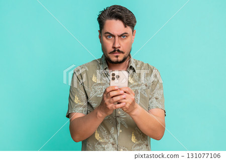 Man anxiously typing fast on smartphone with deep breathing showing stress urgency texting message 131077106