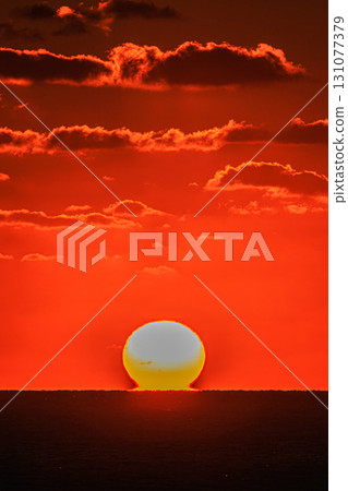 A fantastic Daruma sunset floating in the crimson sky A fantastic Daruma sunset floating in the crimson sky 131077379