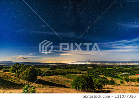 The Perseid meteor shower across the land of Hokkaido and the sparkling starry sky The Perseid meteor shower across the land of Hokkaido and the sparkling starry sky 131077380