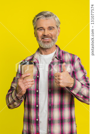 Mature man sipping drinking coffee from plastic cup, relaxed aroma delight, morning taste enjoyment Mature man sipping drinking coffee from plastic cup, relaxed aroma delight, morning taste enjoyment 131077574