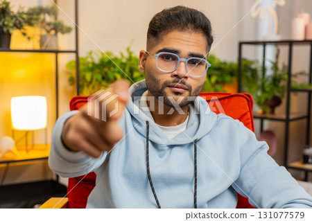 Strict unhappy man pointing finger to camera, looking angry, making choice, accusing for mistake Strict unhappy man pointing finger to camera, looking angry, making choice, accusing for mistake 131077579
